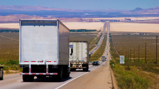 interstate delivery trucks on a highway