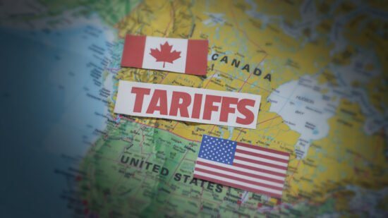 Canada and United States Tariff war concept background with flag and map along typography. Trade, usa, canada, business, tax, import