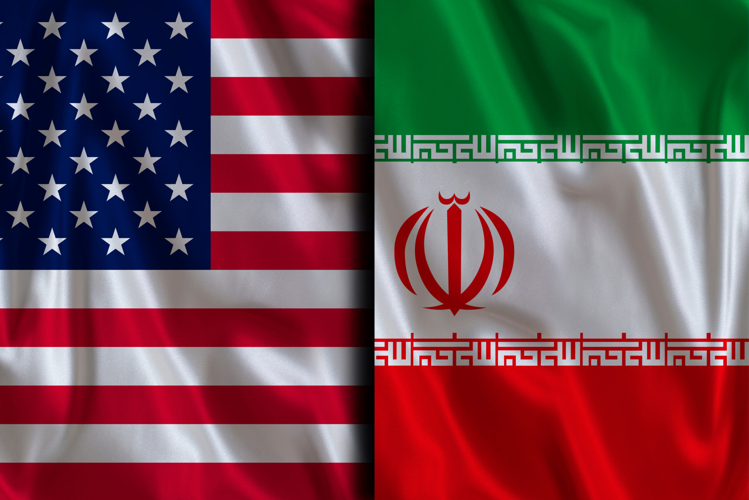 Iranian and American flags on a fabric texture. Geopolitical Tension Between United States and Iran
